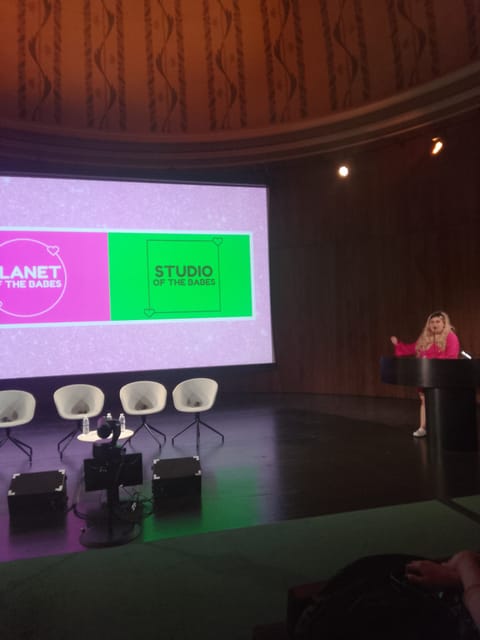 2024-era fake blonde Lylani announces an earlier version of the Baberhood newsletter on stage. Bless her third-person-speaking heart.