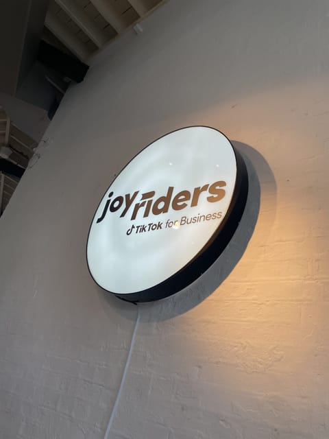 A large light with the TikTok for Business "Joyriders" logo on it.